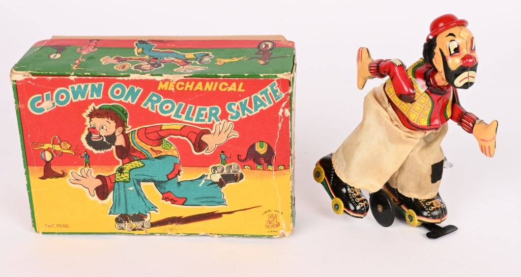TPS TIN WINDUP CLOWN ON ROLLER SKATES w/ BOX: All original and works. Boxed 6 1/2" Excellent