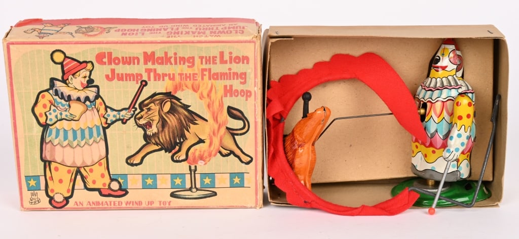 TPS WINDUP CLOWN MAKING LION JUMP THRU HOOP w/BOX: All original and complete. Great condition. Works. Boxed 7" Excellent