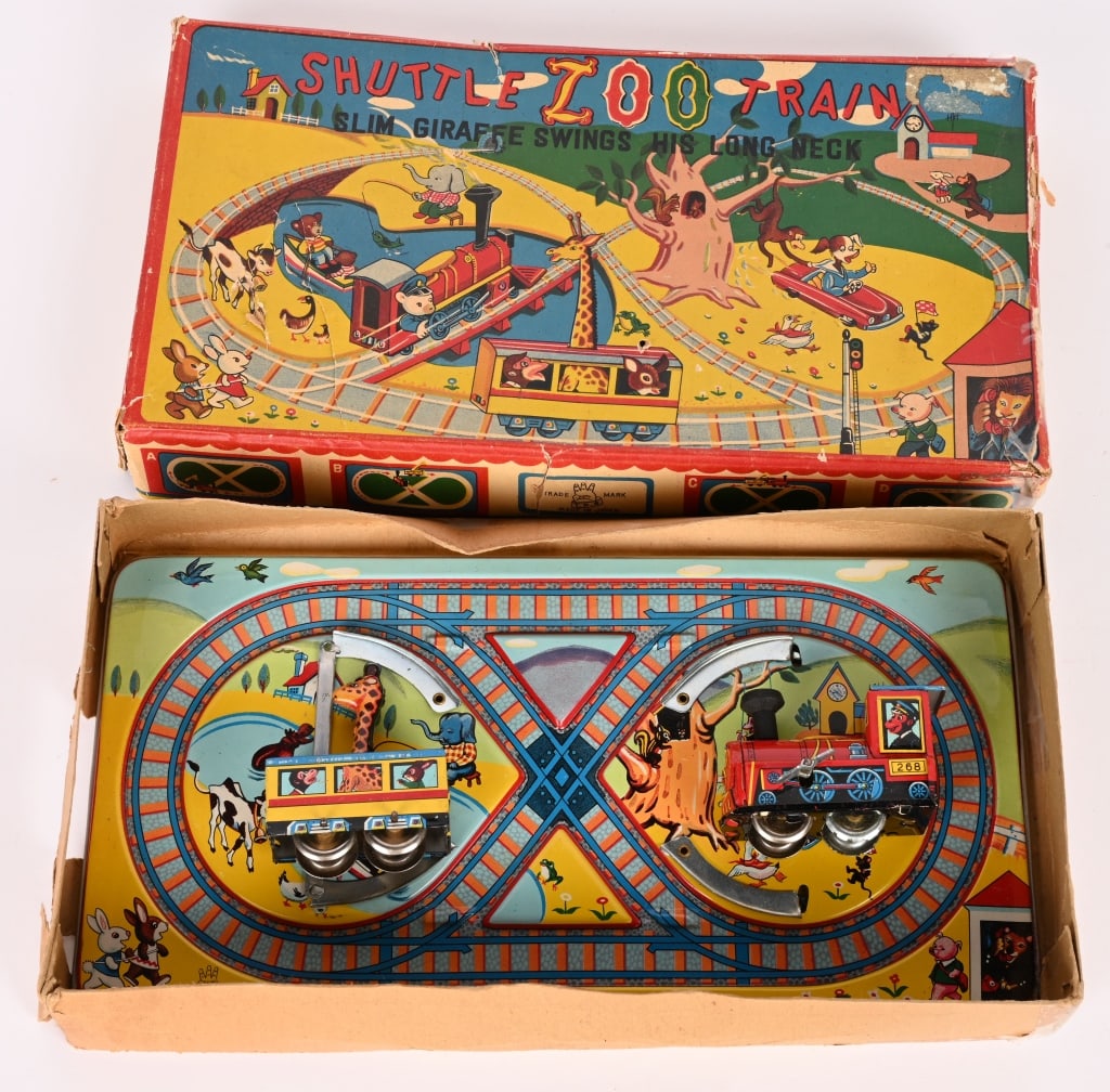 TPS TIN WINDUP SHUTTLING ZOO TRAIN w/ BOX: All original and complete. Very nice condition. Works. hard to find. Boxed 12" Excellent
