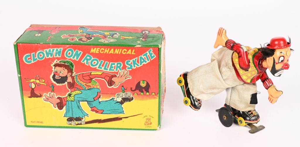 TPS TIN WINDUP CLOWN ON ROLLER SKATES w/ BOX: All original and works. Boxed 6 1/2" Excellent