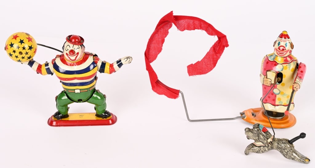 2- TPS TIN WINDUP CLOWN TOYS: Includes Juggling Clown & Clown Trainer and His Dog. Both in nice shape and working. Largest 6" Excellent
