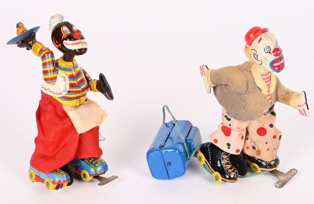 2-- TPS CLOWN SKATERS: Includes windup Black Chef Skater and battery operated Skating Clown not working. Both in nice shape. 7" Excellent