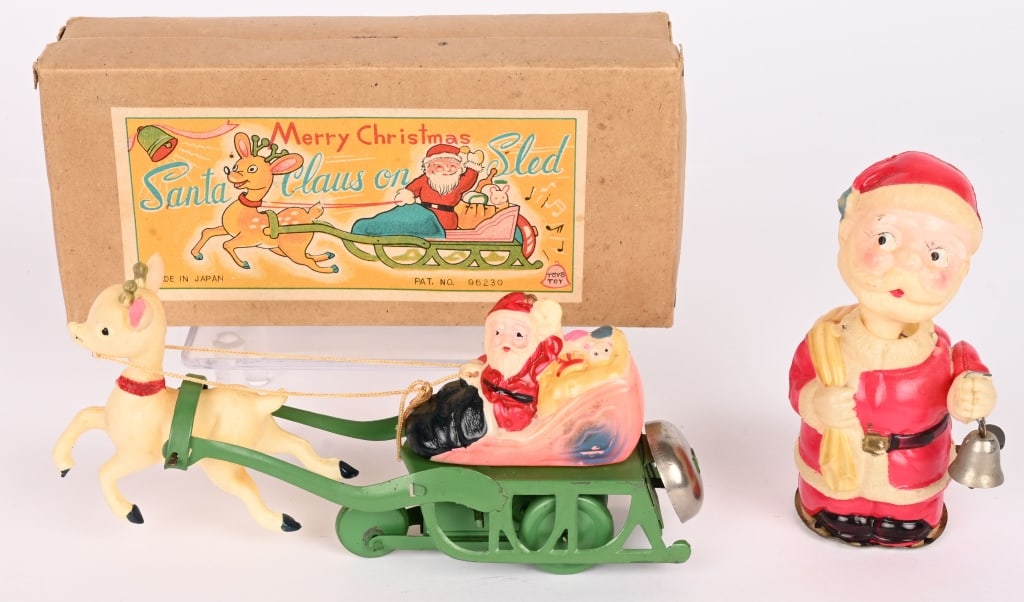 2- JAPAN CELLULOID WINDUP SANTA CLAUS TOYS, 1 BOX: Lot includes: 1. 7" Merry Christmas Santa Claus on Sled. Works great, toy and box are Excellent-Near Mint, 2. 4 3/4" Occupied Japan Santa Claus windup celluloid nodder. Works well, Excellent