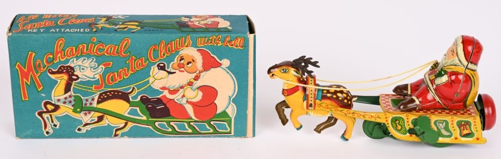 JAPAN TIN WINDUP SANTA CLAUS SLEIGH w/ BOX: Beautiful toy is all tin with rubber antlers. Bright colors with gloss and works well. Color original box is very nice. 7" Excellent-Near Mint