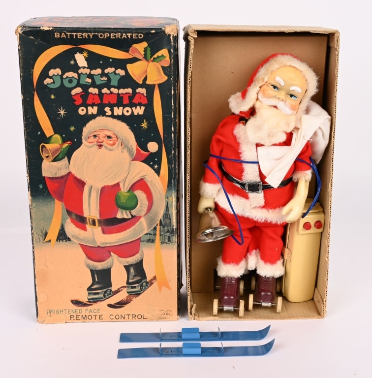 JAPAN BATTERY OP JOLLY SANTA SKIER w/ BOX: Battery operated Santa Claus toy that can be changed from a roller skater to a skier. Worked when tested. Missing one roller skate wheel. Colorful original box has insert. 12" Very Good-Excellent