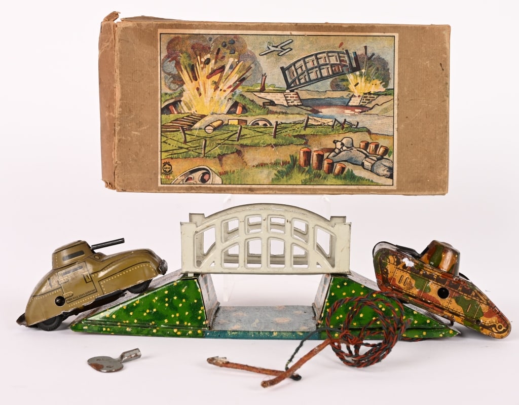 PRE-WAR JAPAN TIN WINDUP EXPLODING BRIDGE & TANKS: Great Pre-War Japan tin windup Exploding Bridge with Tankand Armoured Car. Alloriginal in great shape. Works. Comes with Box. 9 1/2" Excellent