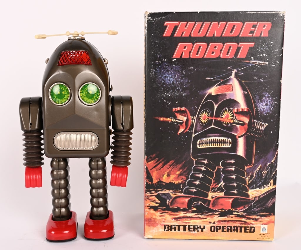 HA HA TOY BATTERY OP THUNDER ROBOT w/ BOX: Contemporary battery operated Thunder Robot. Like new in Box. 12" Near Mint