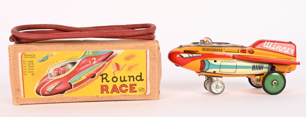 JAPAN TIN WINDUP ROUND RACE ROCKET w/ BOX: All original in great shape. With rubber track. Works. Boxed 5" Excellent