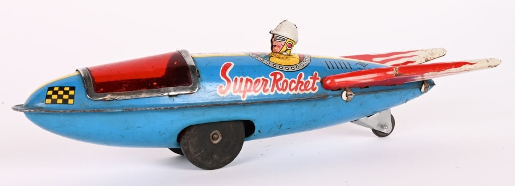 JAPAN TIN FRICTION SUPER ROCKET: All original with nice colors. Friction works. 9" Excellent
