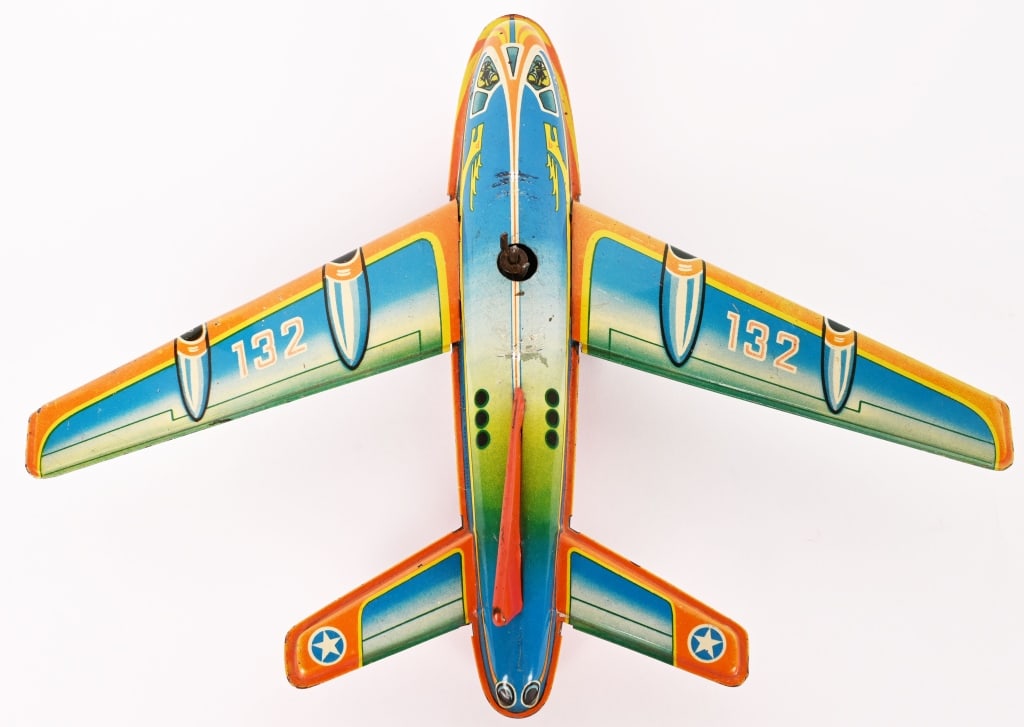 TECHNOFIX FRICTION FLYING SAUCER AEROPLANE: All original with nice colors. Friction works. 9 1/2" Excellent