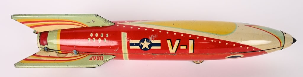 JAPAN TIN FRICTION V-1 SPARKLING ROCKET: All original with great colors. Very nice condition. Friction works. Hard to find Space Toy. 12 1/2" Excellent