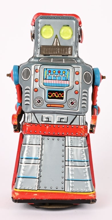 JAPAN TIN WINDUP ATOM ROBOT: All original with yellow eyes. Windup works. 7" Excellent