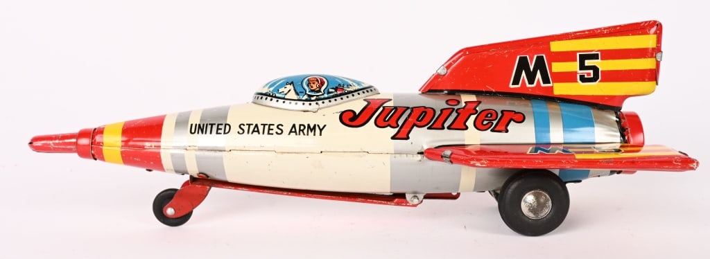 JAPAN TIN FRICTION JUPITER ROCKET: All original withnice graphics. Has Dog in cockpit. Friction works. 9" Excellent