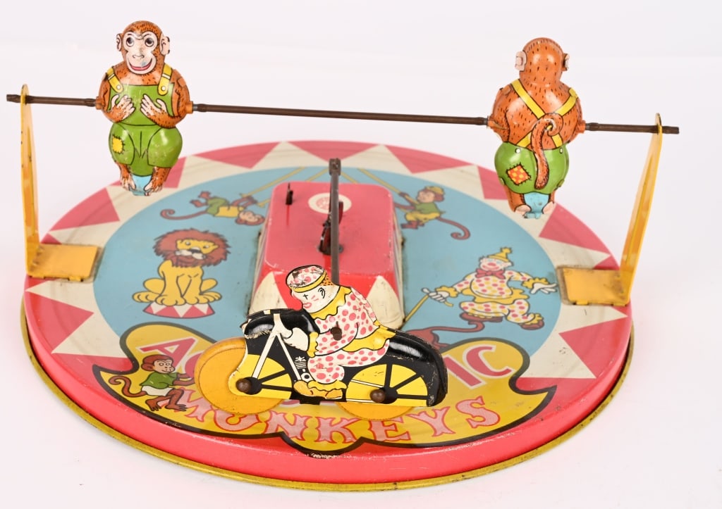 WYANDOTTE TIN WINDUP ACROBAT MONKEYS: All original motorcycle with monkeys. Nice graphics. Works. 10" Excellent