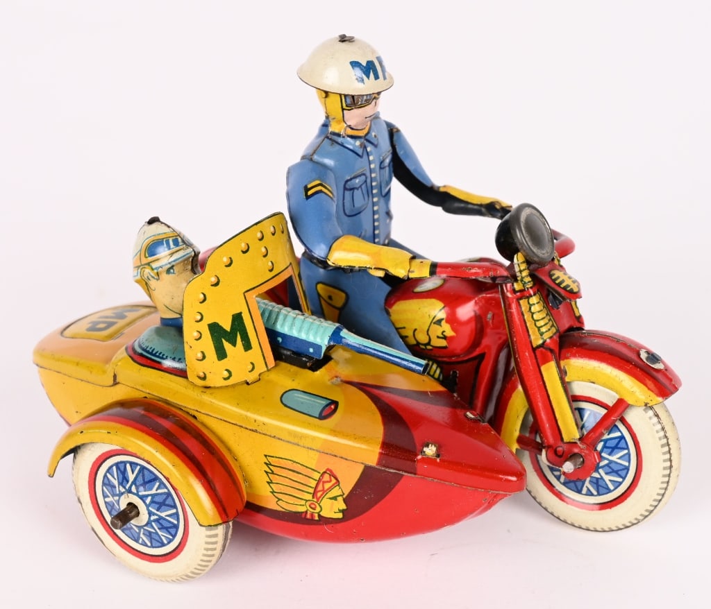 JAPAN WINDUP MP INDIAN MOTORCYCLE w/ SIDECAR: Japan tin windup MP Indian Motorcycle with Sidecar. All original and complete. Has Indian on gas tank. Passenger in sidecar has machine gun. Windup works. 4 1/2" Excellent
