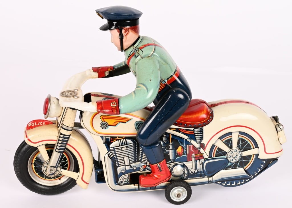 JAPAN BATTERY OP POLICE MOTORCYCLE: Japan battery operated Police Motorcycle. Large toy where rider gets on and off. All original in great shape. Did not when tested. 12" Excellent