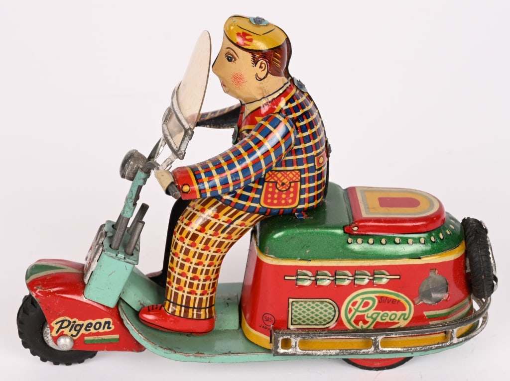 JAPAN TIN FRICTION PIGEON SCOOTER: Japan friction Pigeon Scooter. All original and complete. Toy has great colors. Friction works. 6" Excellent