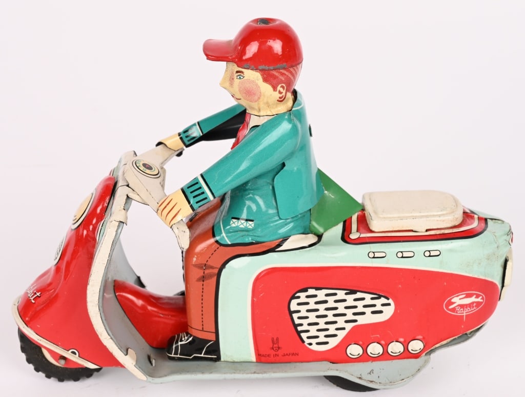 JAPAN TIN FRICTION RABBIT SCOOTER: All original with nice colors. Friction works. 6 1/2" Excellent