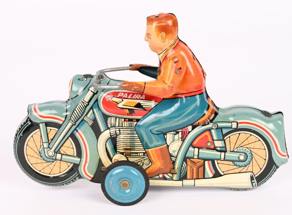 SANKEI TIN FRICTION PALIRA MOTORCYCLE: Japan tin friction Palria Motorcycle. All original with great colors. Super clean condition. Friction works. A very scarce toy motorcycle. 7" Excellent