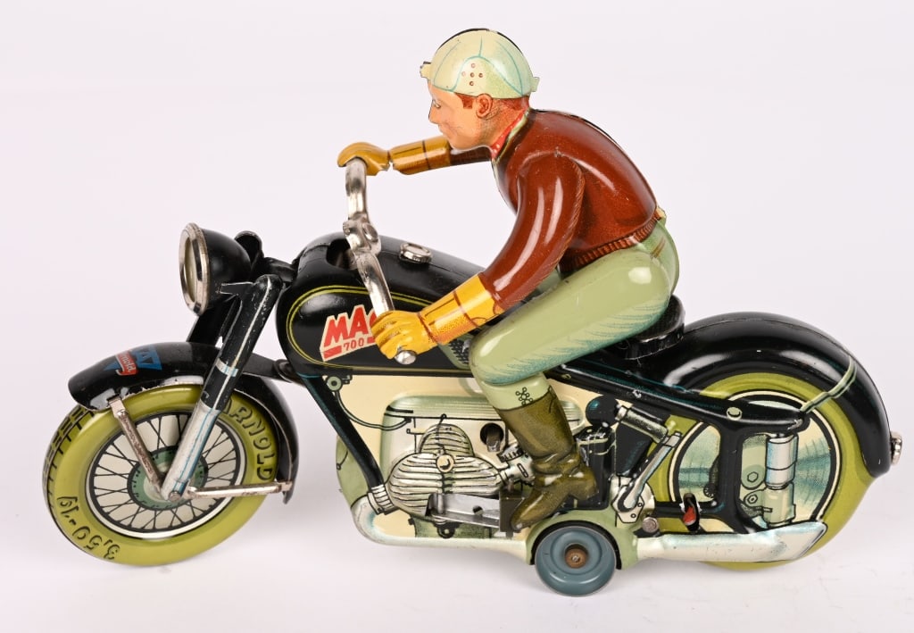 ARNOLD TIN WINDUP MAC 700 MOTORCYCLE: All original in nice shape. Black version. Rider get off an don the bike. Works. 7 1/2" Excellent
