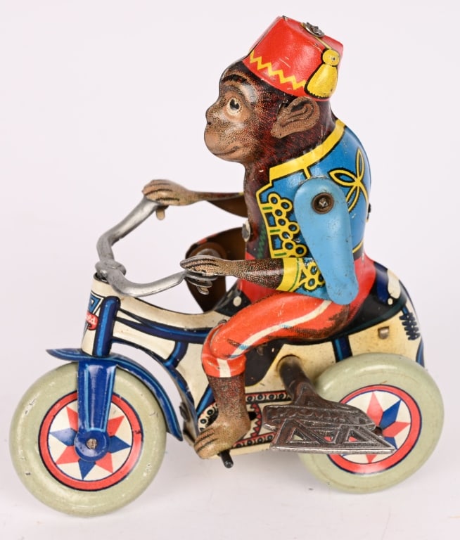 ARNOLD TIN WINDUP MONKEY ON TRIKE: All original. In great shape. Works. 4 1/2" Excellent