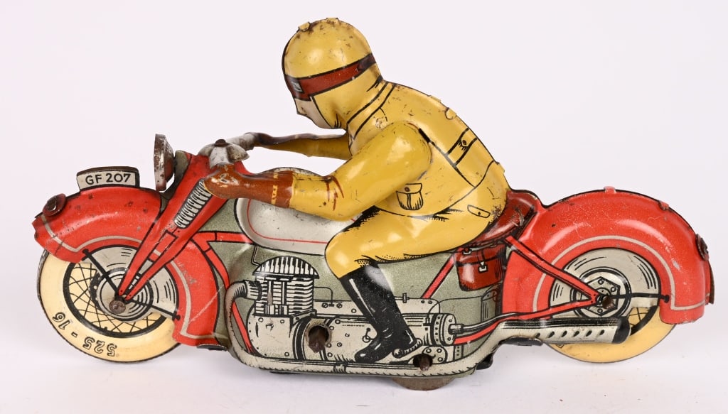GERMAN FISCHER TIN WINDUP MOTORCYCLE: German motorcycle marked GF 207. Very detailed motorcycle toy that worked when tested. Changes directions as it goes. No key is included. 5" Excellent