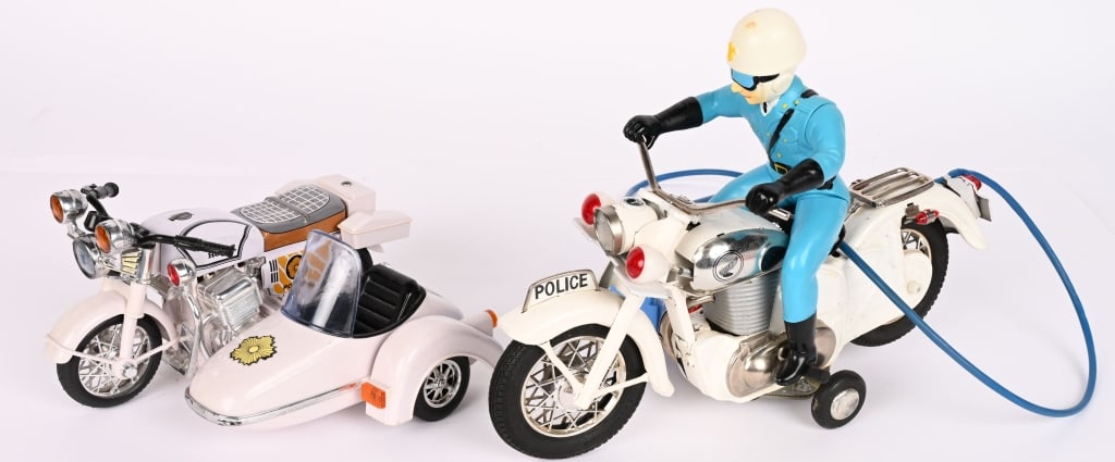 2- HONDA BATTERY OPERATED MOTORCYCLES: Both in great condition. Largest 11" Excellent