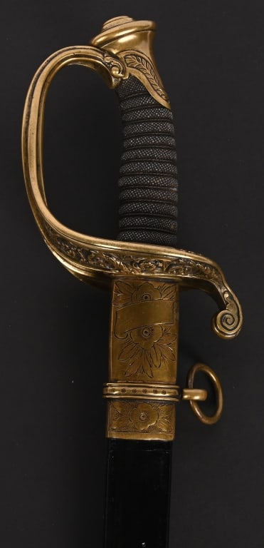 CIVIL WAR MODEL 1850 FOOT OFFICER's SWORD TIFFANY: Civil War Federal model 1850 Foot Officer's sword by Tiffany New York measuring 37 inches overall. Right side of blade with etched 3/4 panel featuring arms motifs and an eagle "Federal Eagle. The