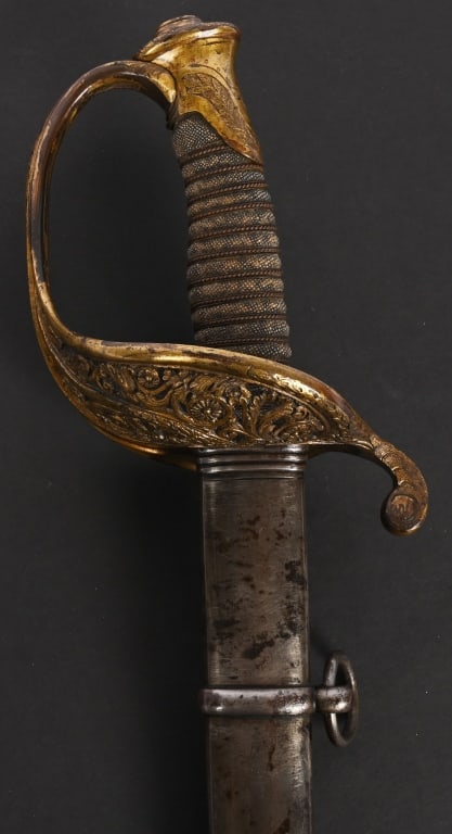 CIVIL WAR M1850 FOOT OFFICERS SWORD BY CLAUGERG: A very attractive Civil War Foot Officers Sword by Clauberg and was imported by the famous firm Schuyler Hartley & Graham measuring overall 38 1/2 inches with a 32 inch, triple engraved blade with a b