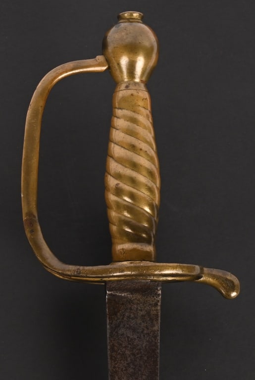 HESSIAN REVOLUTIONARY WAR HANGER SWORD REGT MARKD: Circa 1740-1780, this German hanger has a slightly curved steel blade with flat sides. The heart-shaped guard. Spiraling cast brass grip and two-piece cast brass pommel with integral capstan. Blade re