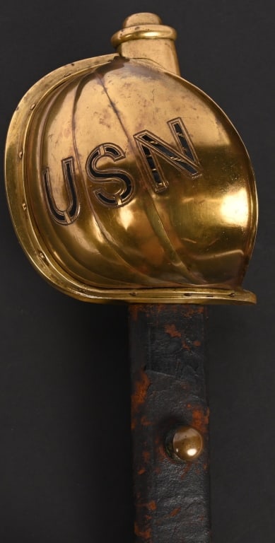 CIVIL WAR AMES NAVAL OFFICER'S CUTLASS 1862: Civil War Ames Officer's Naval Cutlass with cut out USN on guard. Blade is marked Made by Ames Mfg. Co. Chicopee Mass. on one side and "1862 " on the other side. The blade is full length with an unsto