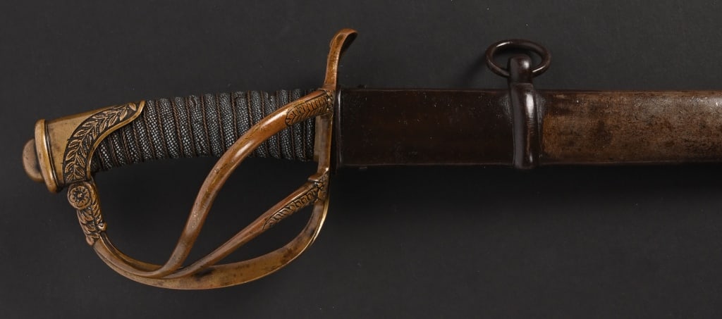 CIVIL WAR CAVALRY OFFICERS SWORD BY E.F. HORSTER: This is a lovely example of a relatively scarce US M-1840 Cavalry Officer’s Saber by the firm E.F. Horster of Solingen. Overall size is 40 1/2 inches in length. Brass hilt with three bar guards,
