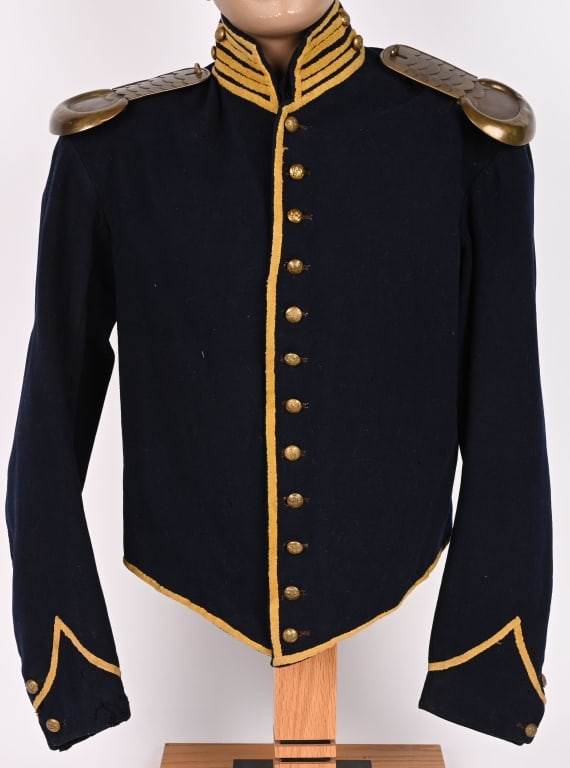 CIVIL WAR FEDERAL FIELD CAVALRY SHELL JACKET: Standard issue dark blue wool shell jacket with yellow piping on collar and cuffs with red trim down the front and along the edges. Jacket has 12 General Service eagle buttons down the front with two 
