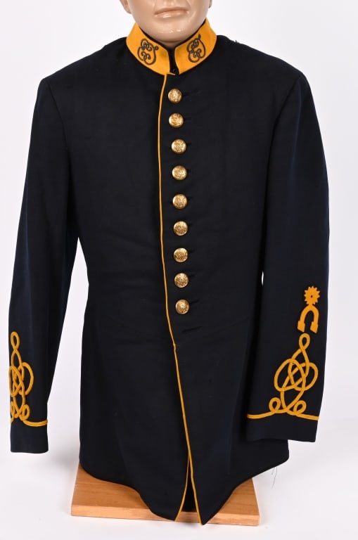 M1885 US CAVALRY DRESS COAT NAMED W INSIGNIA: The dark blue wool dress tunic shows some minor wear to the exterior, but the tunic is overall quite clean and without holes or damage. The coat has a 10 button front (bottom button is missing).