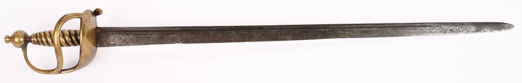 HESSIAN REVOLUTIONARY WAR HANGER SWORD: Circa 1740-1780, this German hanger has a slightly curved steel blade with flat sides. The heart-shaped guard. Spiraling cast brass grip and two-piece cast brass pommel with integral capstan. Blade re