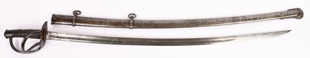 CIVIL WAR 1840 WRIST BREAKER TIFFANY CAVALRY SWORD: 41 1/2" with a 35 1/2" blade that is 1 1/4" wide at ricasso. Marked PDL on left ricasso, and Tiffany co. New York on the right side. Enlisted sabers manufactured by maker P.D.L. (P. D. Luneschoss) of 