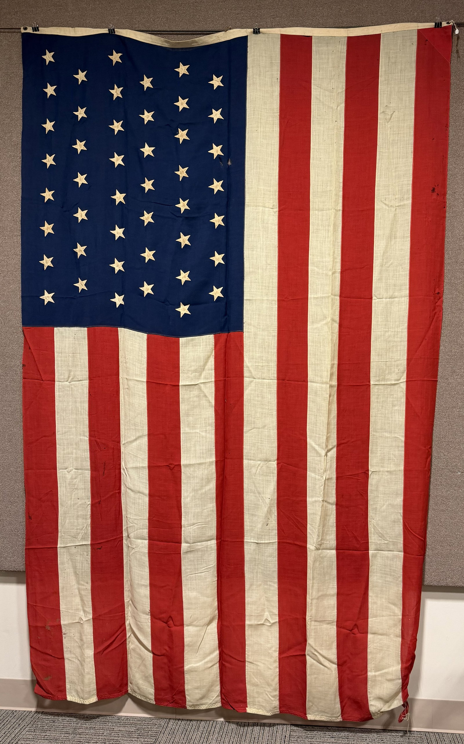 SPANISH AMERICAN WAR 45 STAR UNITED STATES FLAG: 7 X 11 Feet wool flag with 45 separately applied cotton stars. Hoist end is marked "STANDARD 7 X 11" Overall excellent condition with a few small holes but no rips or tears. The 45-star flag became th