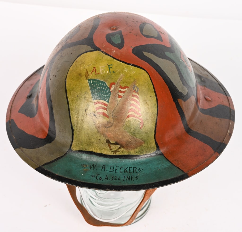 WW1 82ND DIVISION PAINTED HELMET W FLAG & EAGLE: WW1 top shelf British Made Camo Painted Helmet that is identified to W. A. Becker of Co. A 326th Infantry. To the front an American Flag with an Eagle and the initials A.E.F. above. To its side a smal