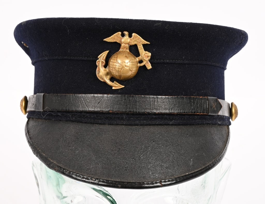 US MARINE CORPS 1904 PATTERN VISOR CAP USMC: This is a 1904 pattern enlisted man's dress blue cap made by W H Horstman out of Philadelphia. While these caps were adopted too late to see service in the Spanish American War they would have seen se