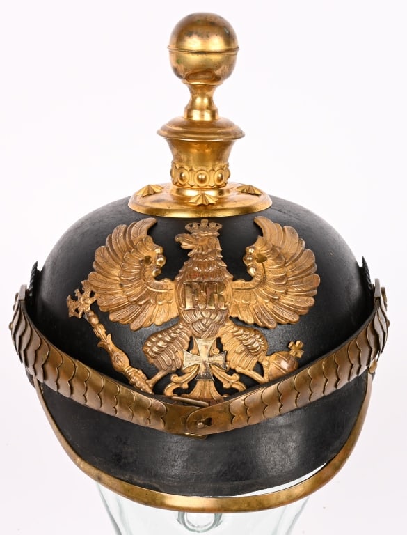 WWI IMPERIAL PRUSSIAN ARTILLERY RESERVE HELMET WW1: Black leather helmet with very minor crazing to the helmet body. Brass fittings including the non-removable artillery kugel, spike base, studs, front visor trim, M91 side posts, rear spine and the