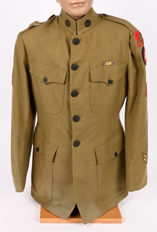 WWI US ARMY 332ND INFANTRY DIVISION UNIFORM WW1: A very attractive WWI US Army 332nd Regiment Uniform Jacket that is double Patched with US & 332nd Collar Disk. To the lower sleeve are two Overseas Stripes and above it, a Red Discharge Stripe. 
