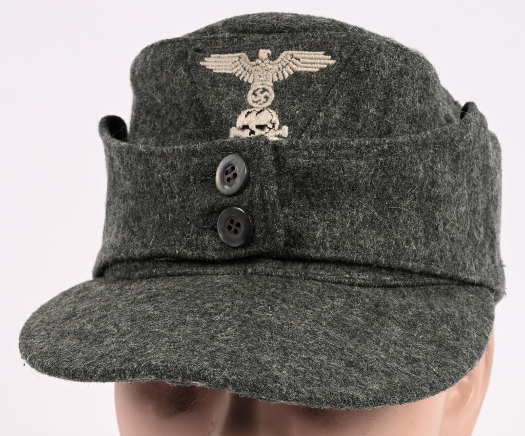 WWII NAZI GERMAN WAFFEN SS M43 FIELD CAP WW2: Ersatz recycled, field-gray wool/rayon blend construction cap. The cap features fold down back and side panels with scalloped front edge and forward sides and two, small, gray button retainers. The ba
