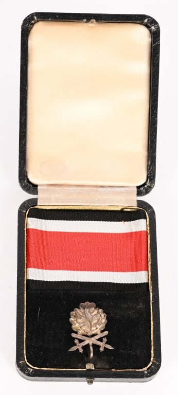 WWII CASED KNIGHT CROSS OAK LEAVES & SWORDS L/50: A set of Oak Leaves and Swords in the issue Case marked to the reverse 925 SIlber L/50 indicating the maker Godet. The case is well-preserved presentation for the Oak Leaves and Swords to the Knight&#