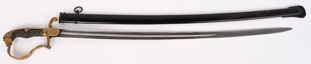 WWI IMPERIAL GERMAN LION HEAD ENGRAVED SWORD WW1: Imperial German Heavy Grosse Blade Cavalry Lion Head Sword with Ruby Eyes. Overall size is 37 1/2 inches with a 30 1/2 inch, triple engraved blade. The blade is maker marked to WKC under the langets. 
