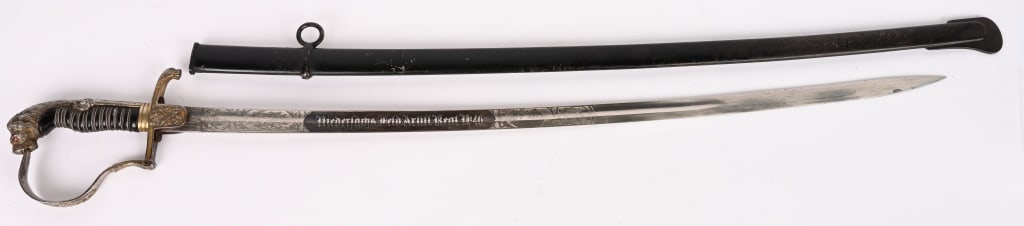 WWI IMPERIAL GERMAN 46th ARTILLERY REGT. SWORD WW1: A beautiful Imperial German Lion Head Sword with a Double Engraved Blade. To the obverse "Die Erinnerung an meine Dienstzeit" The memory of my time in service with oak leaves and crest motifs. The rev