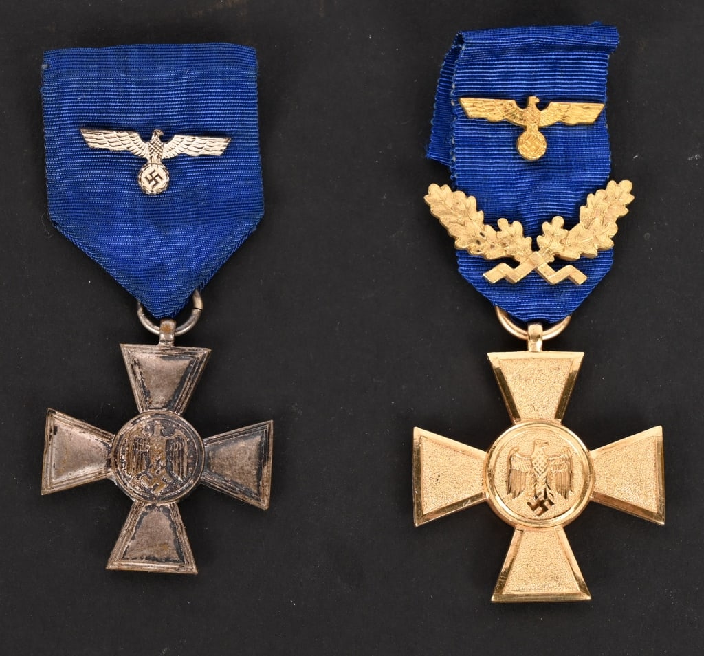 WWII NAZI GERMAN 25 & 18 LONG SERVICE MEDAL LOT: WWII Nazi German Medal lot to include 1) HEER EIGHTEEN YEAR LONG SERVICE MEDAL. Die struck, magnetic metal construction award with a silver washed finish is in the form of a cross Pattée with a c