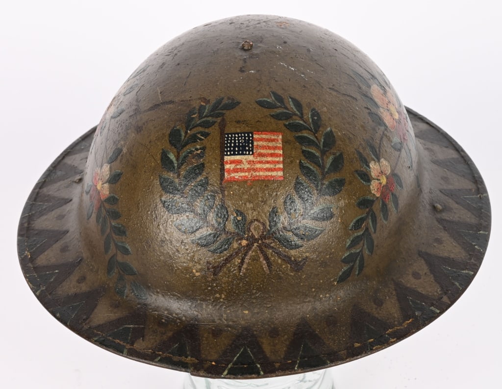 WW1 PAINTED 1ST DIVISION HELMET W EAGLE & FLAG WWI: A Top shelf US Painted Helmet, most likely painted by a 1st Division Shoulder with an American Federal Eagle Shield painted in brown with light tan accents, To the sides are laurel wreaths with flower