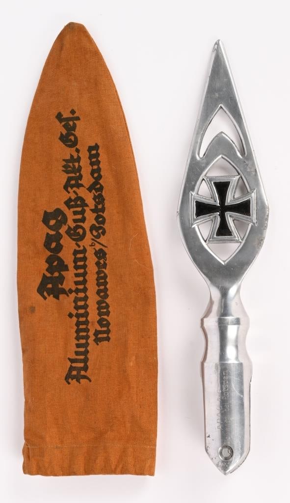 WWII NAZI GERMAN FLAG POLE TOP W PROTECTIVE COVER: A very attractive WWII Nazi German Flag Pole Top with Case. Overall size of the Finial is 9 3/4 inches and is engraved on the side of the Pole Top "ALPAS Mod. Potsdam EK Ges Gesch" to one side of the