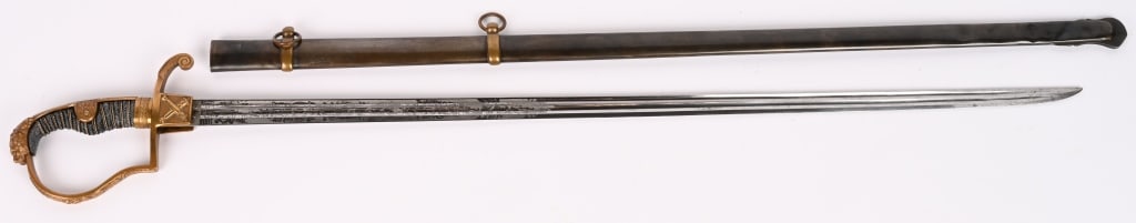 WWI IMPERIAL GERMAN ENGRAVED GROSSE OFFICER SWORD: A very attractive Lion Head Imperial German Officers Sword from an Artillery Member, The beautifully triple engraved sword has a double fullered straight blade that is very clean and maker