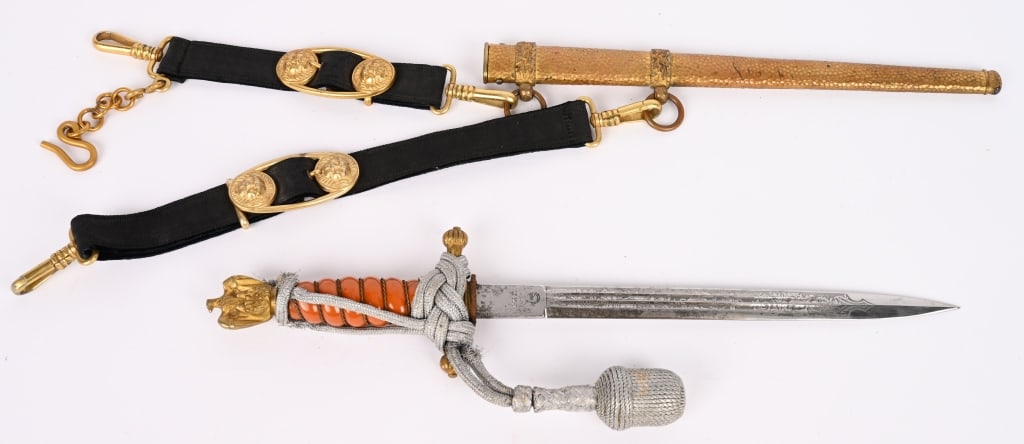 WWII NAZI NAVAL DAGGER BY WKC WITH HANGERS WW2: Approximately 25cm long nickel/silver plated drop forged steel stiletto style blade with narrow dual central fullers to each side. The blade features an acid etched design with fouled anchors, a multi